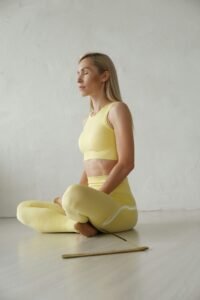 person practicing a seated yoga pose